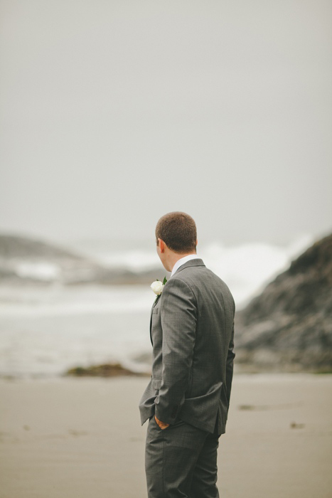 groom waiting on the beach for his bride