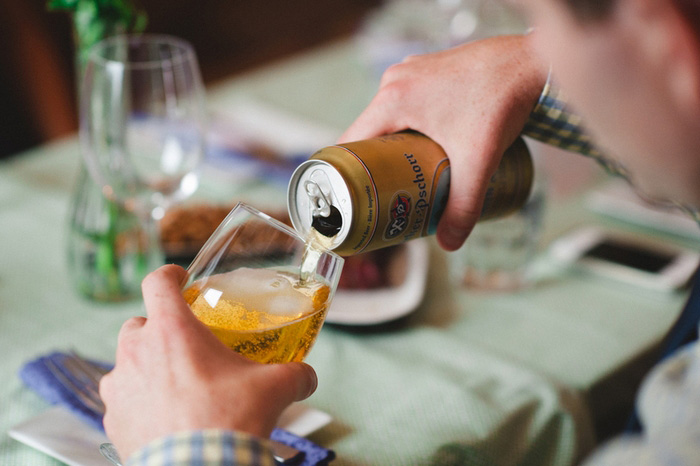 wedding guest pouring beer