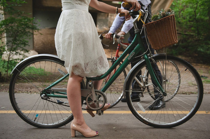 bride and groom on bikes