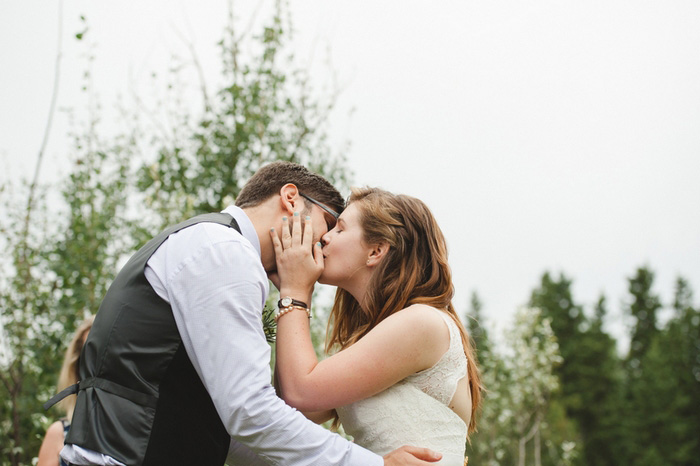 bride and groom first kiss