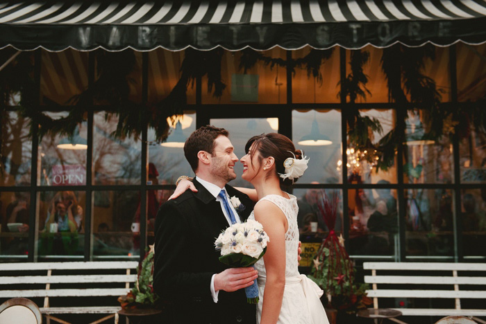 bride and groom portrait outside of store