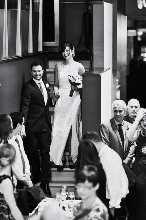 bride and groom walking down stairs