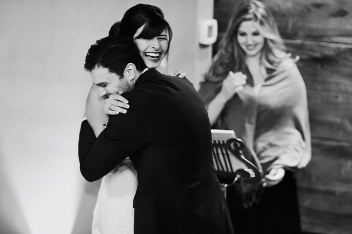 groom hugging bride during ceremony