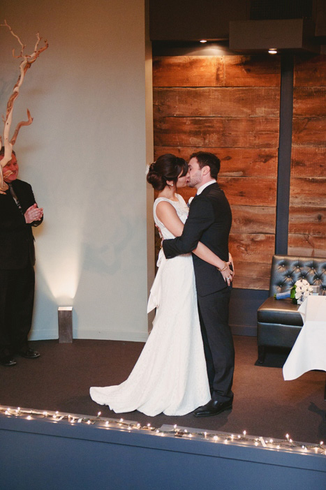 bride and groom first kiss