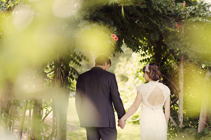 bride and groom walking hand inhand