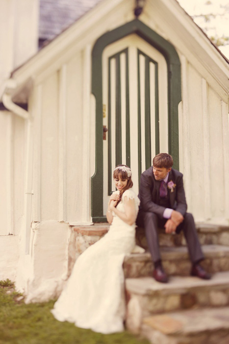 bride and groom on chapel steps