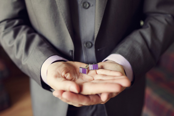 groom with purple cuff links