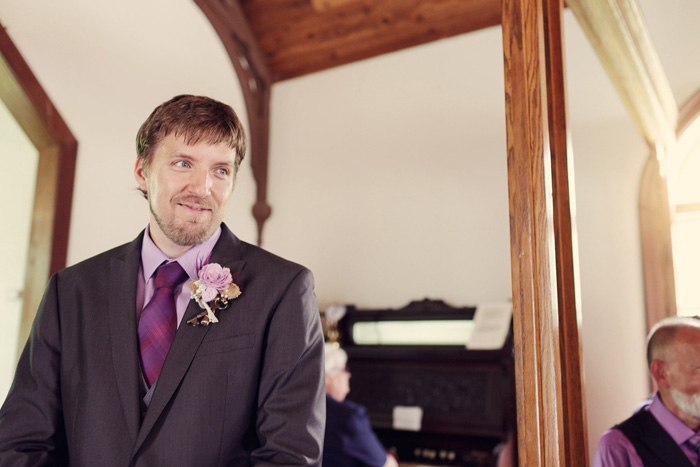 groom waiting at the altar