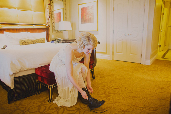 bride lacing up her boots