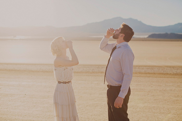 bride and groom taking a shot