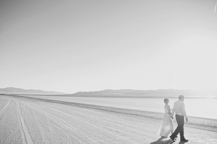 bride and groom walking across nevada road