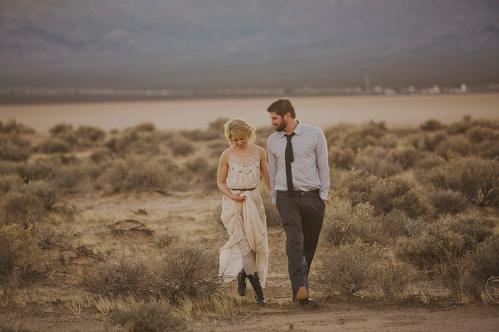 couple walking through the desert