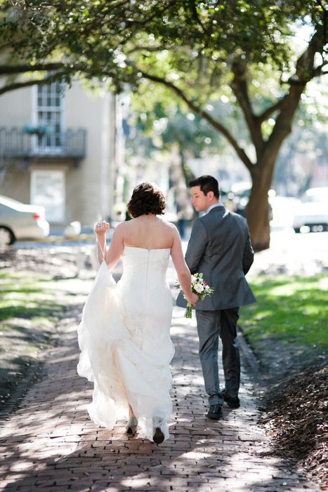 bride and groom walking down the street