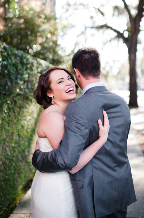 bride and groom hugging and laughing