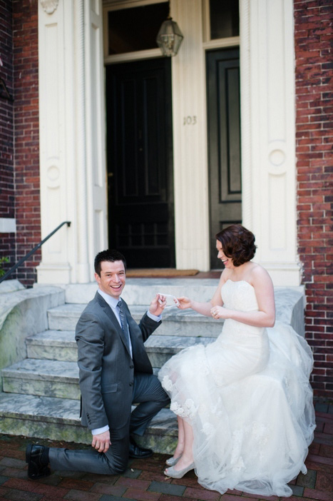 bride and groom holding garter