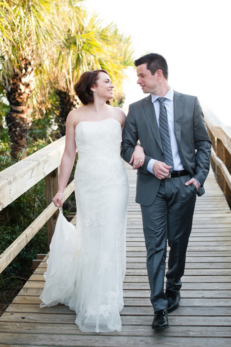 bride and groom walking on the boardwalk