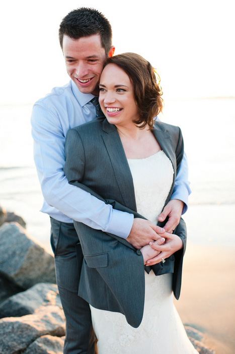 bride wearing groom's jacket