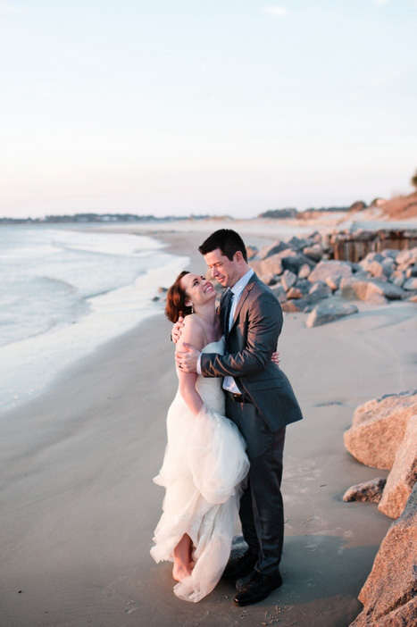 bride and groom by the ocean