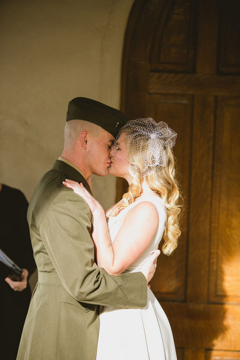 bride and groom first kiss