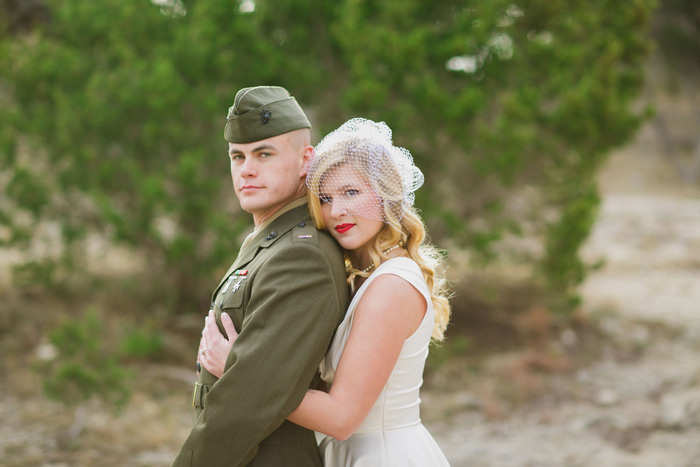 bride embracing groom from behind