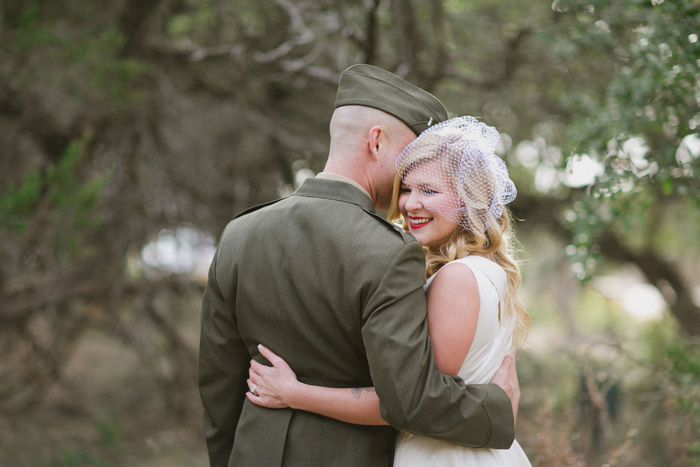 groom whispering in bride's ear