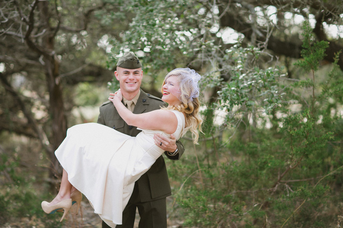 groom carrying bride