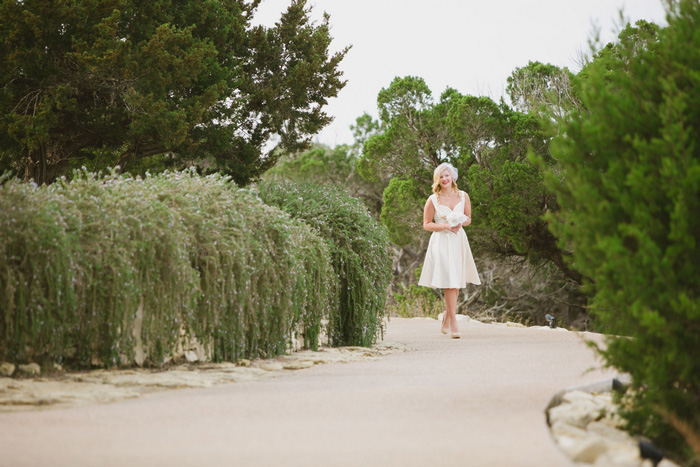 bride walking towards chapel