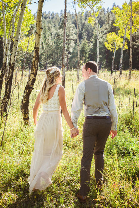 bride and groom walking hand in hand