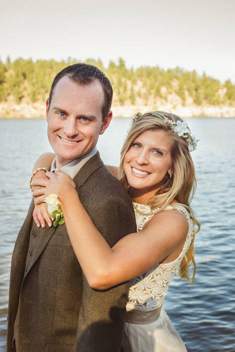 bride and groom by the lake