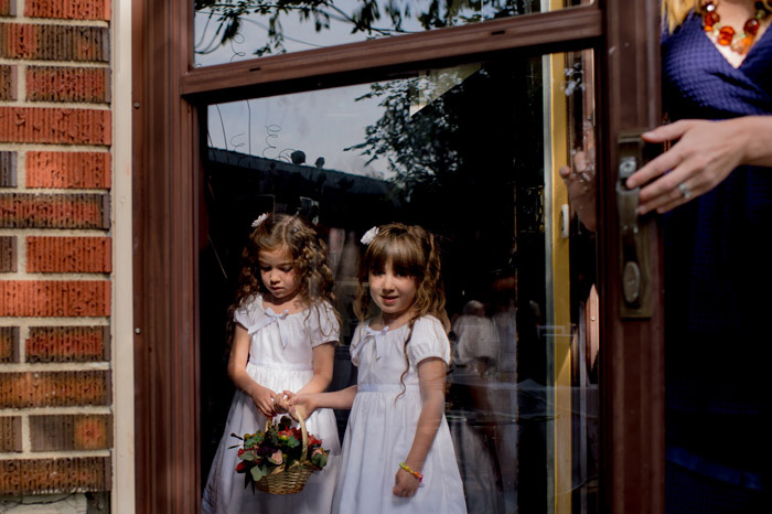 flower girls waiting in doorway