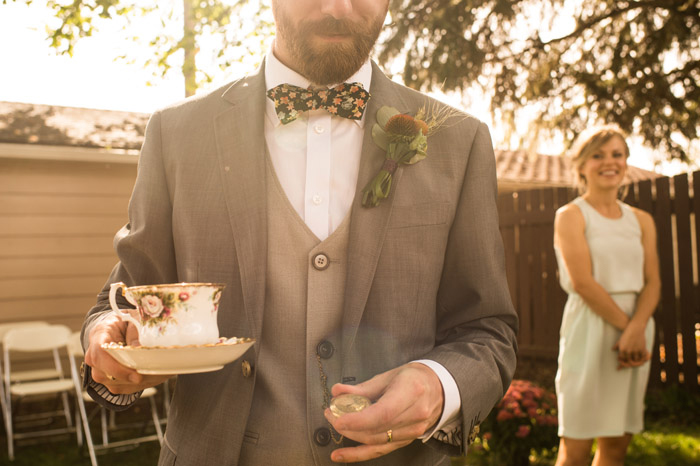 groom in floral bow tie 