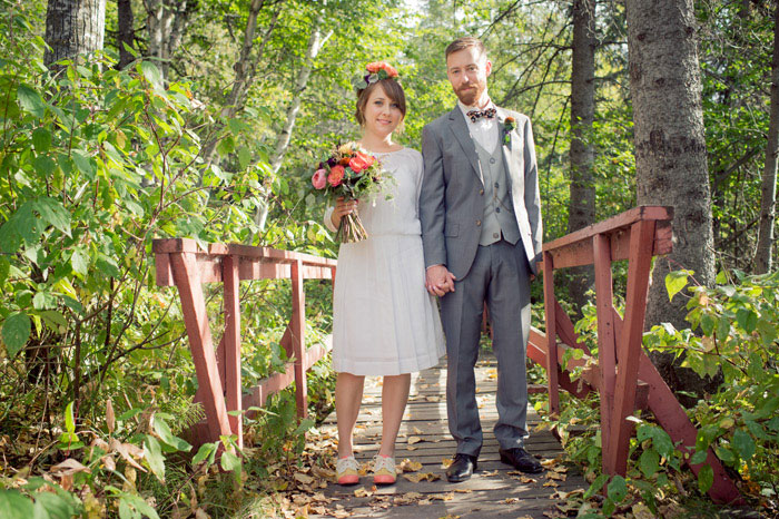 bride and groom portrait on bridge