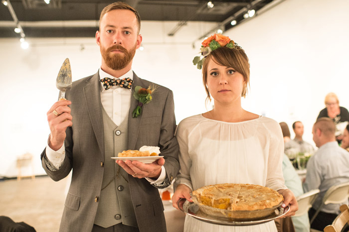 bride and groom with pie