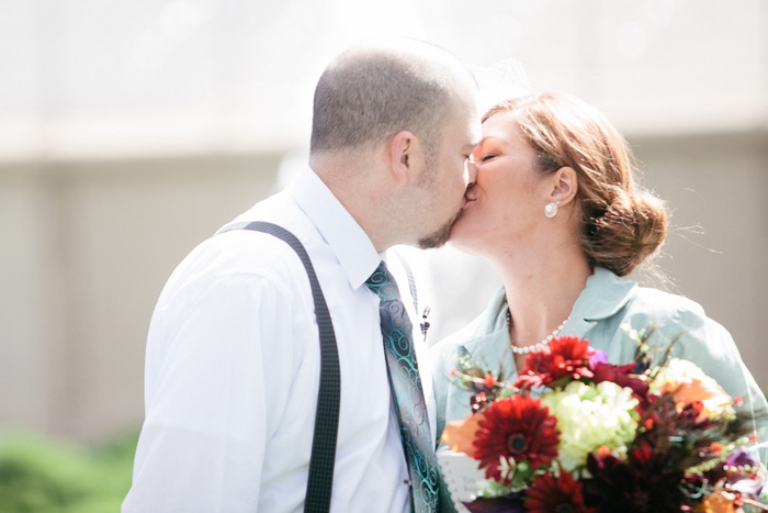 bride and groom first kiss