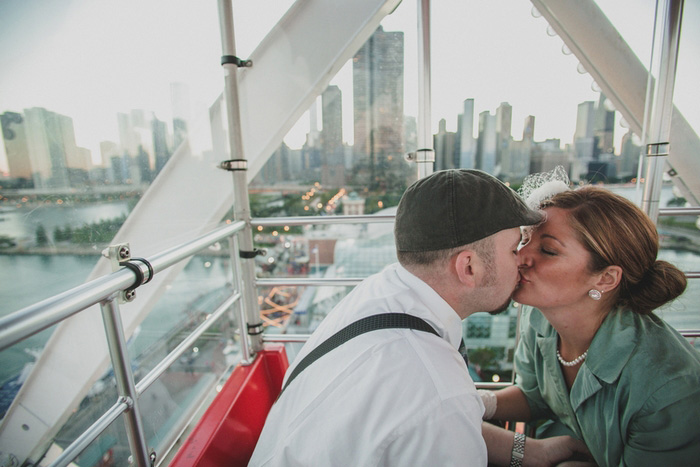 bride and groom kissing on Ferris Wheel