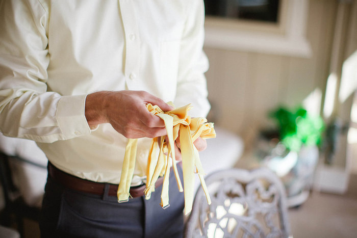groom with yellow bow ties