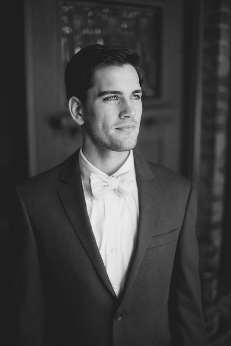 black and white groom portrait