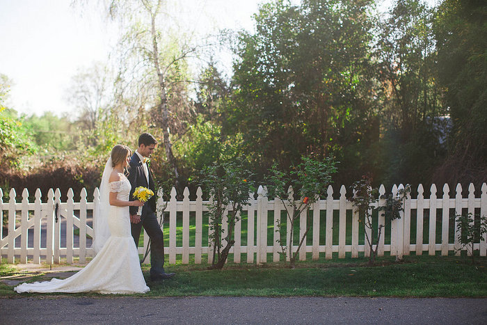 bride and groom walking on farm