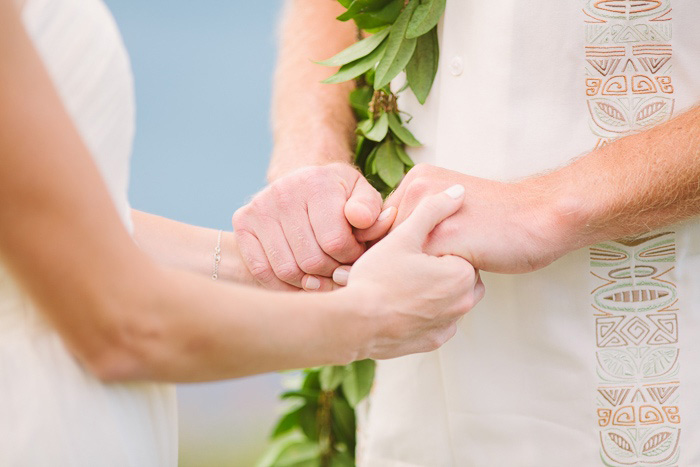 bride and groom holding hands