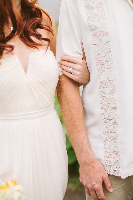 bride and groom linking arms