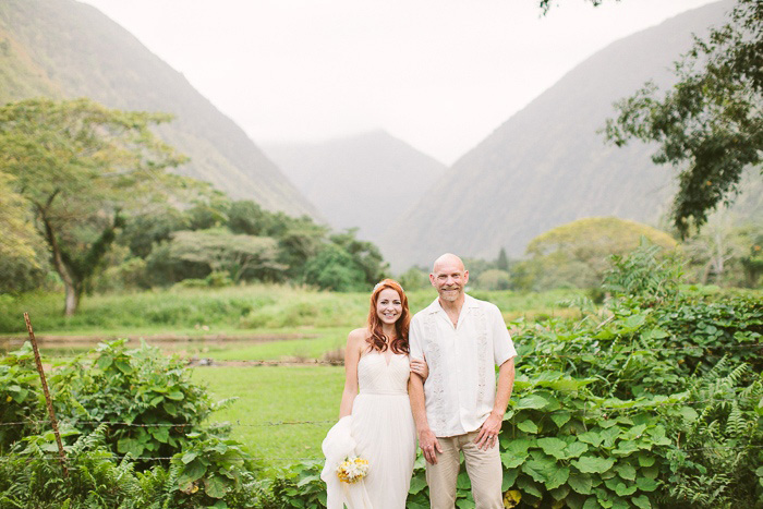 bride and groom portrait in front of Hawaiian mountains