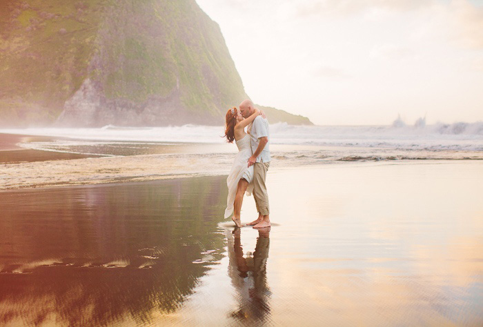 bride and groom kissing on the beach