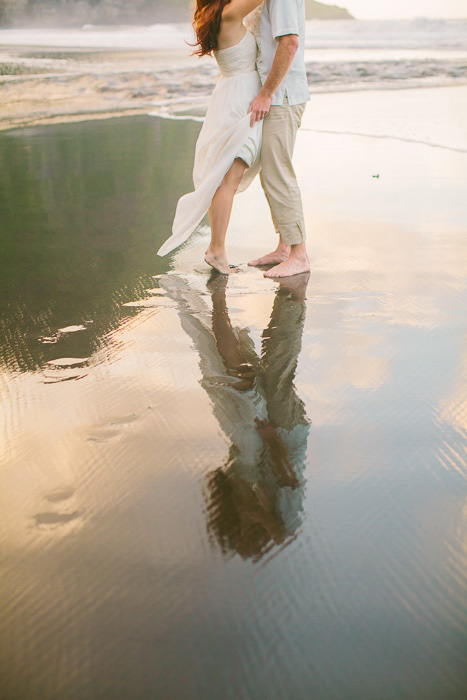 bride and groom reflection in the water