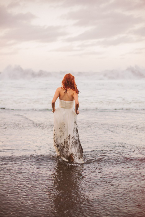 bride walking into the ocean