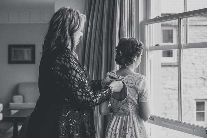 bride putting on her dress