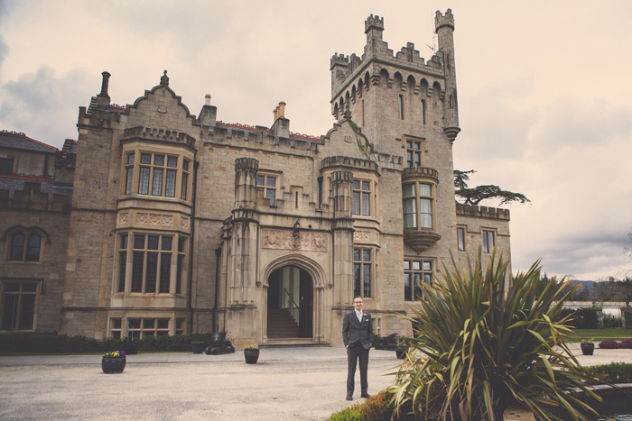 groom waiting outside irish castle