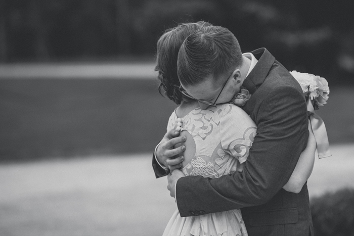 bride and groom hugging