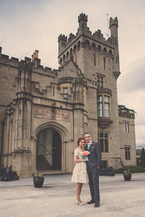 bride and groom outside irish castle