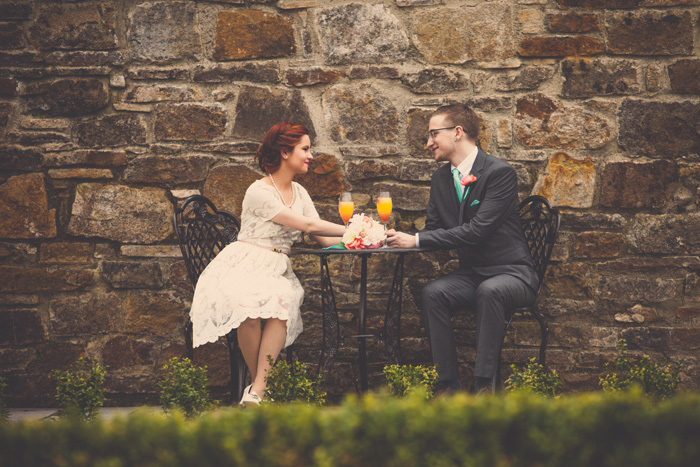 bride and groom drinking mimosas