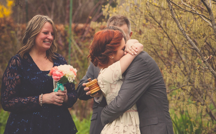 bride and groom hugging during ceremony